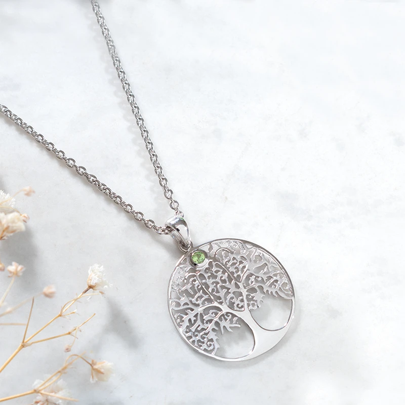 Silver tree of life necklace with peridot stone