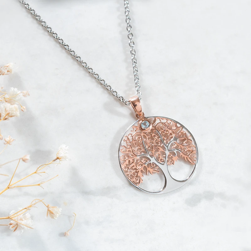 Silver & rose gold tree of life pendant with blue topaz