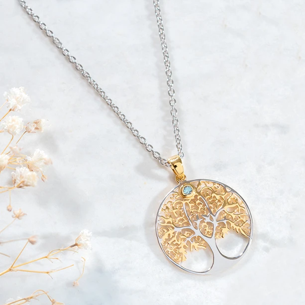 Tree of life necklace in yellow gold plated silver with blue stone